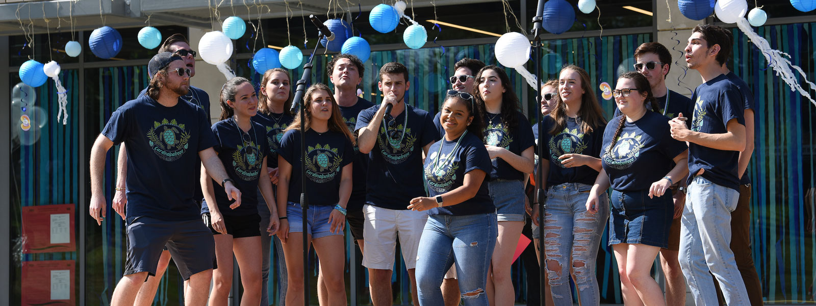 Group of students singing at end-of-year celebration